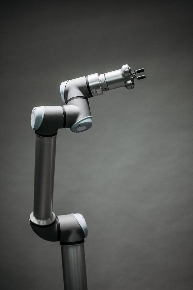 Industrial robotic arm in a studio setting